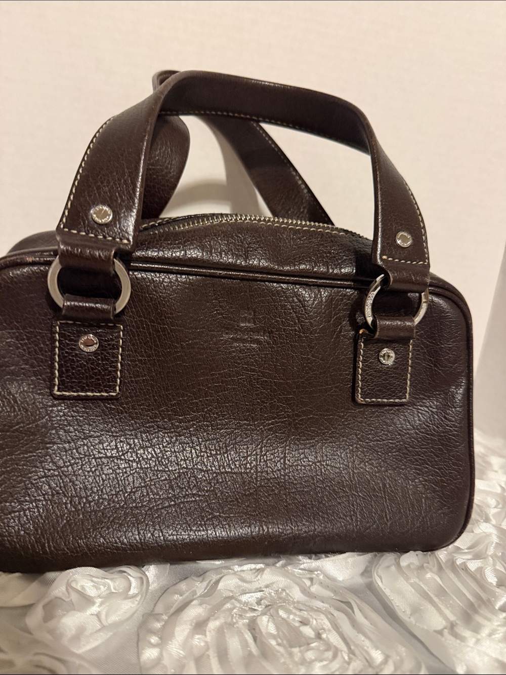 Kate Spade New York brown leather satchel.